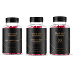 Three Black Girl Vitamins bottles: Hair, Skin & Nails; Once a Day Vitamins; D3 dietary supplements with flavors and quantities.